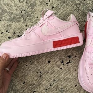 Women’s pink Nike Air Force ones